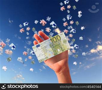 pieces of euro banknote puzzle getting together