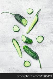 Pieces of fresh cucumbers. On rustic background. Pieces of fresh cucumbers.