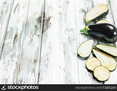 Pieces of fresh eggplant .On wooden background. Pieces of fresh eggplant.