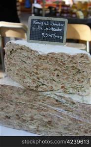 pieces of fresh made nougat at a market in the Provence, France