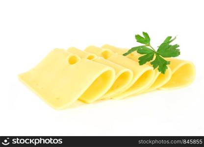 Pieces of fresh yellow cheese with parsley isolated on a white background in close-up
