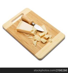 pieces of Parmesan cheese on wooden cutting board. white background. pieces of Parmesan cheese on wooden cutting board