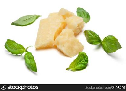 pieces of Parmesan cheese with basil isolated on white background. pieces of Parmesan cheese with basil on white background