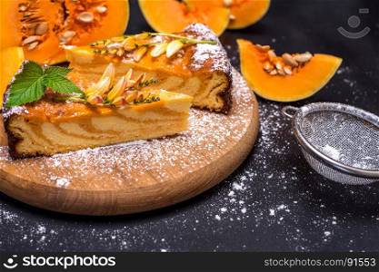 pieces of pumpkin pie on a wooden board, close up