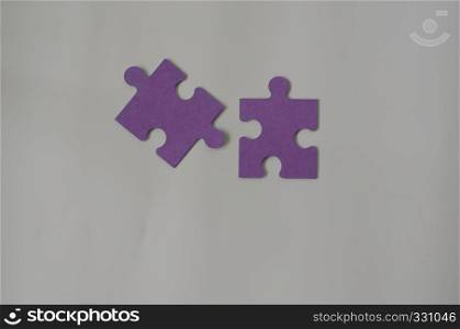 Pieces of purple jigsaw puzzle .Business connection, success and strategy concept, copy space