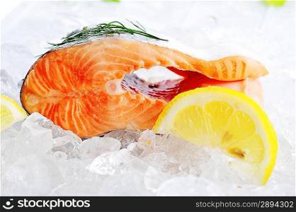 pieces of red fish and lemon on ice