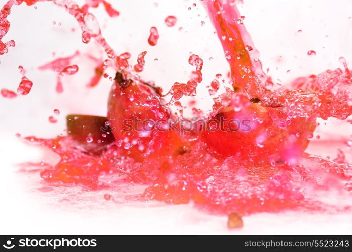 pieces of red ripe pomegranate in juice