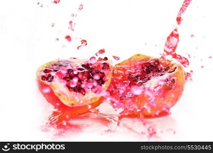 pieces of red ripe pomegranate in juice