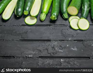 Pieces of ripe zucchini. On rustic background. Pieces of ripe zucchini.