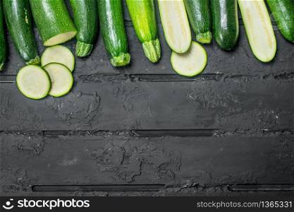 Pieces of ripe zucchini. On rustic background. Pieces of ripe zucchini.
