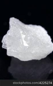 pieces of rock sugar crystal over black background