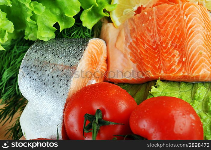 pieces of salmon with spice on wooden plate