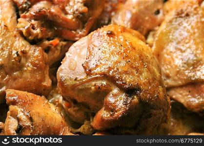 Pieces of tasty roast chicken close up
