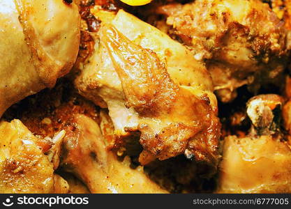 Pieces of tasty roast chicken close up