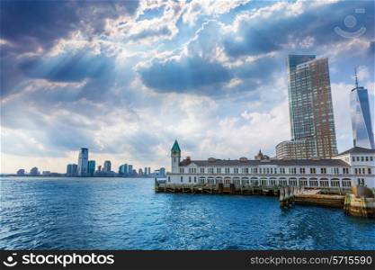 Pier A in Battery Park Manhattan skyline New York and Jersey with dramatic sky