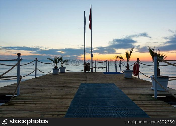 Pier at sunrise over the Mediterranean Sea in Antalya
