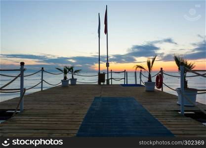 Pier at sunrise over the Mediterranean Sea in Antalya