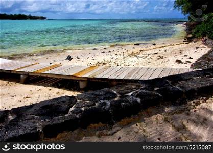 pier blue bay foam footstep indian ocean some stone in the island of deus cocos in mauritius