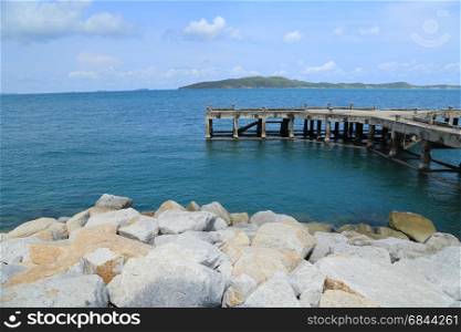 Pier by the sea and rocks at Rayong, Thailand