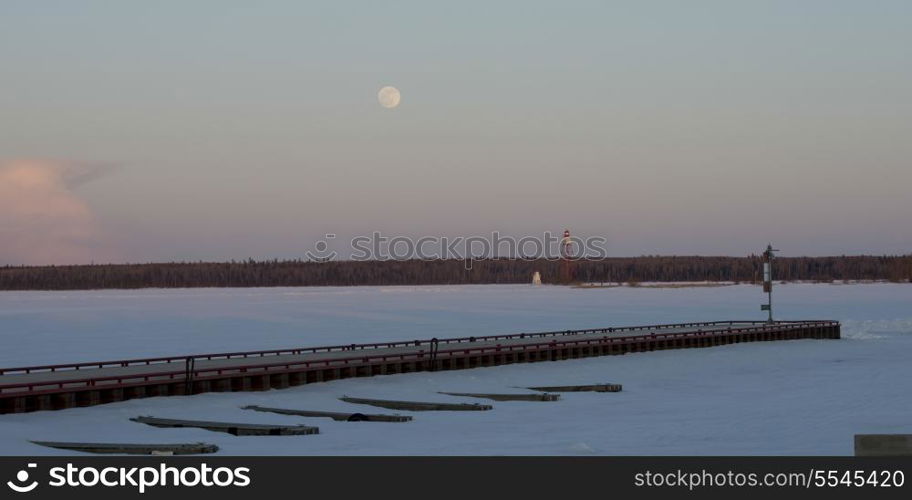 Pier on a frozen lake, Lake Winnipeg, Riverton, Hecla Grindstone Provincial Park, Manitoba, Canada