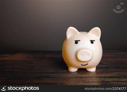 Pig piggy bank proudly looks to the side. Copy space. Confidence and satisfaction. Be cool. Savings and money, investments and deposits in the bank. Earning and increasing wealth.