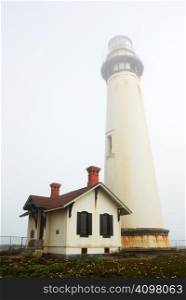 Pigeon Point Lighthouse near Pescadero, California on a foggy day.