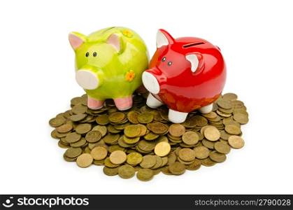Piggy bank and coins isolated on white