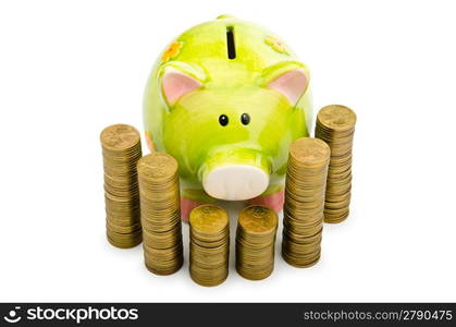 Piggy bank and coins isolated on white