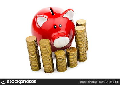 Piggy bank and coins isolated on white