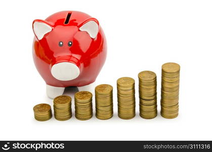 Piggy bank and coins isolated on white