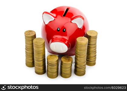 Piggy bank and coins isolated on white