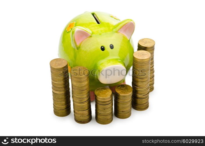 Piggy bank and coins isolated on white