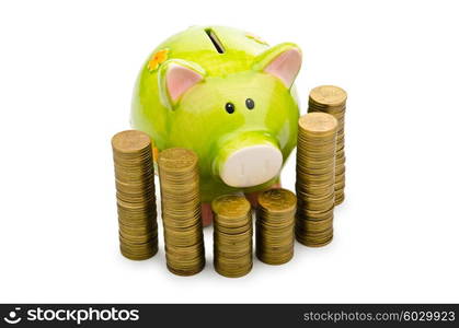 Piggy bank and coins isolated on white