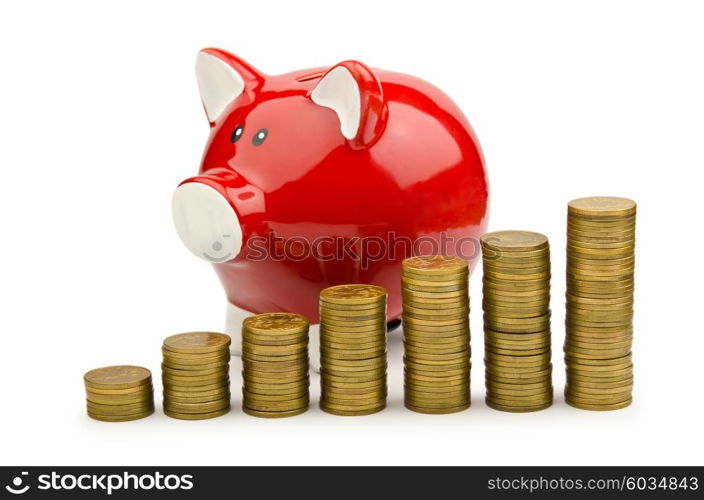 Piggy bank and coins isolated on white