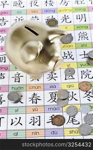 Piggy bank and coins on Chinese calendar