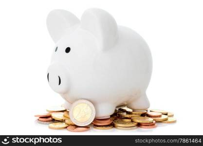 Piggy bank and coins pile on white background