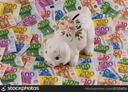 piggy bank and euro banknotes money. image for saving.