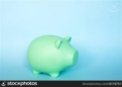 Piggy bank highlighted on a blue background.. Piggy bank highlighted on a blue background