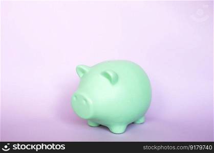 Piggy bank highlighted on a purple background.. Piggy bank highlighted on a purple background