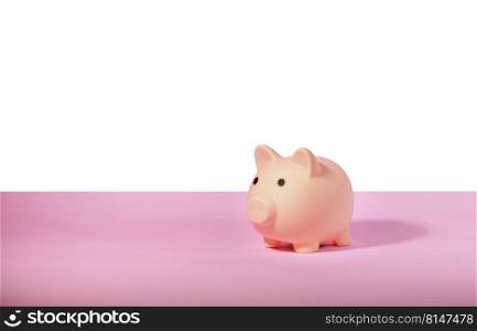 Piggy bank isolated on pink background. Saving money concept. 
