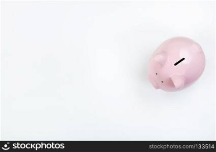 Piggy Bank on white desktop with copy space