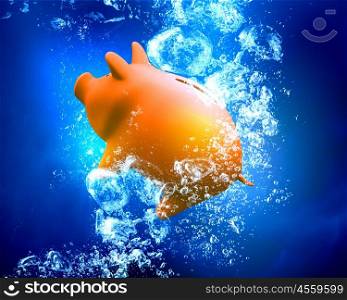 Piggy bank under water. Piggy bank sink in clear blue water