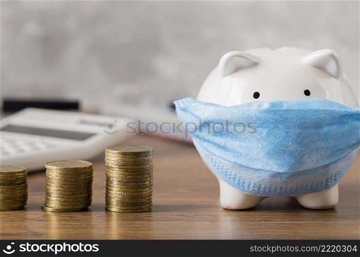 piggy bank with medical mask coins