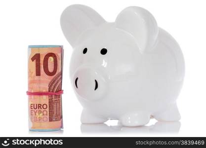Piggy bank with money roll, isolated on white background
