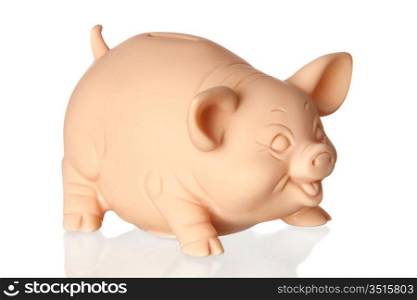 Piggy bank with reflection on the floor isolated on white background