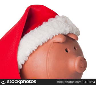 Piggy bank with Santa Claus hat isolated on white