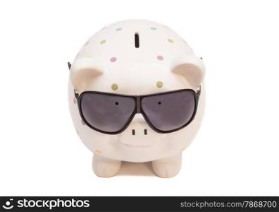 Piggy bank with sunglasses isolated