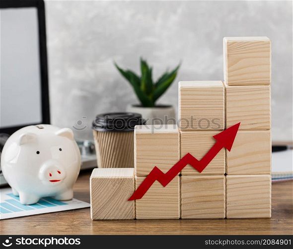 piggy bank with wooden growth blocks