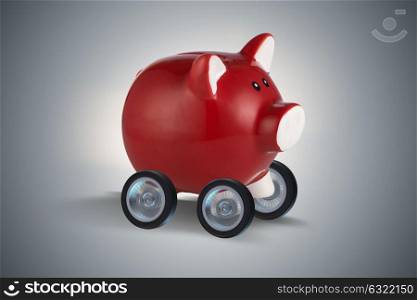 Piggybank driving away on wheels 3d rendering