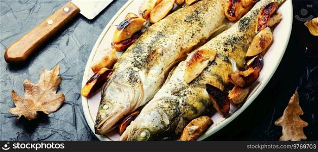 Pike perch baked with autumn fruits.Fish seasonal recipe. Baked dietary fish with quince